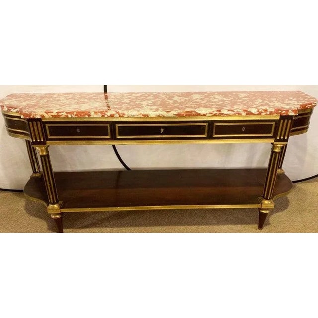 A palatial Russian neoclassical marble top console table or sideboard. This very late 19th-early 20th century sideboard or...