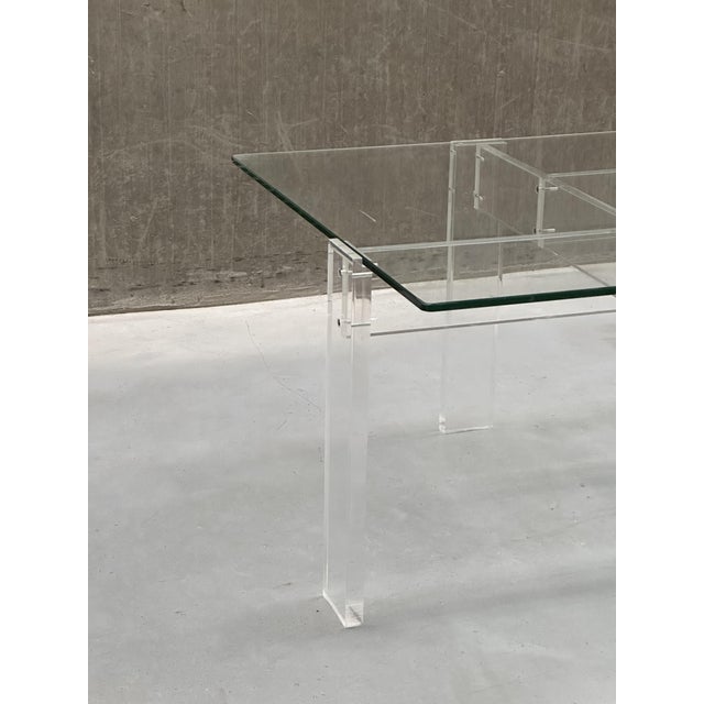 Meet this exquisite vintage acrylic coffee table with a glass top. This striking piece combines retro transparency with a...