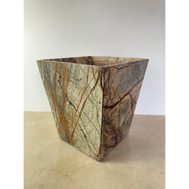 Substantial vintage waste basket carved from a single dramatic slab of rainforest-style marble, featuring rich rust,...