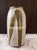 A substantial 9-inch hand-thrown studio pottery vessel by artist Nora, dating to the 1970s American studio craft movement....