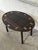 This adaptable butler table features a smart design with hinged, drop-down sides and cutout handles. The classic...