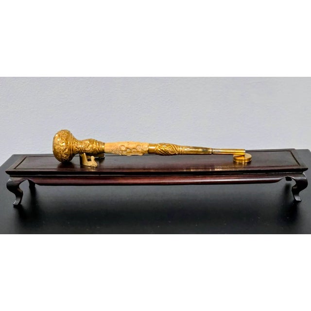 Presenting a remarkable antique cane handle, masterfully crafted from solid brass and carved bovine bone. This ornate...