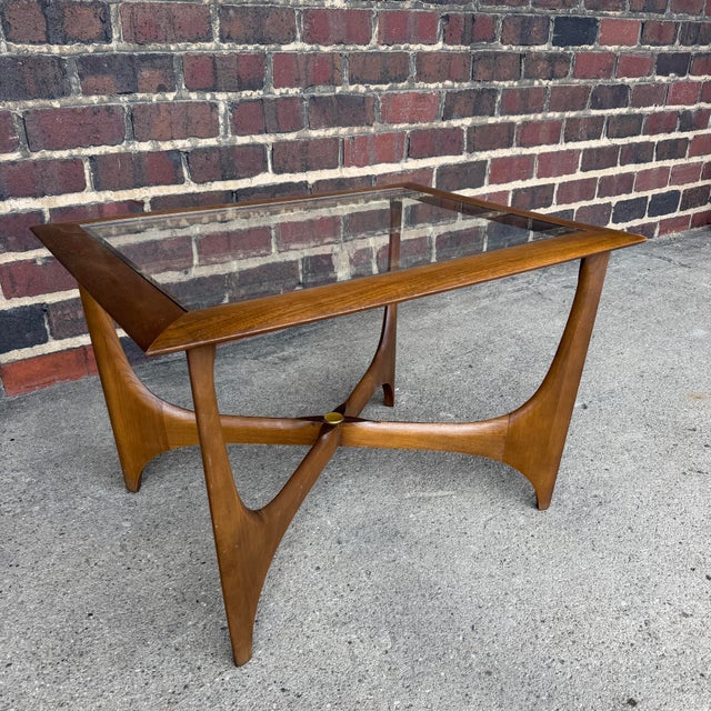 Exceptional vintage Mid-Century Modern coffee or cocktail table from Lane Furniture’s Silhouette collection, designed by...