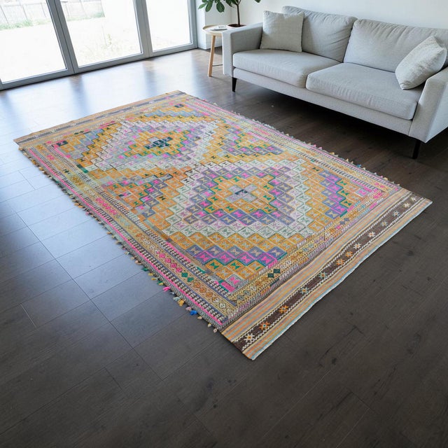 Woven in the Aegean region of Anatolia during the 1960s, this flat weave Oushak kilim is an exceptional example of...