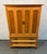 Elegant vintage Thomasville gentleman’s chest crafted in oak and distinguished by its striking faux lattice front. The...