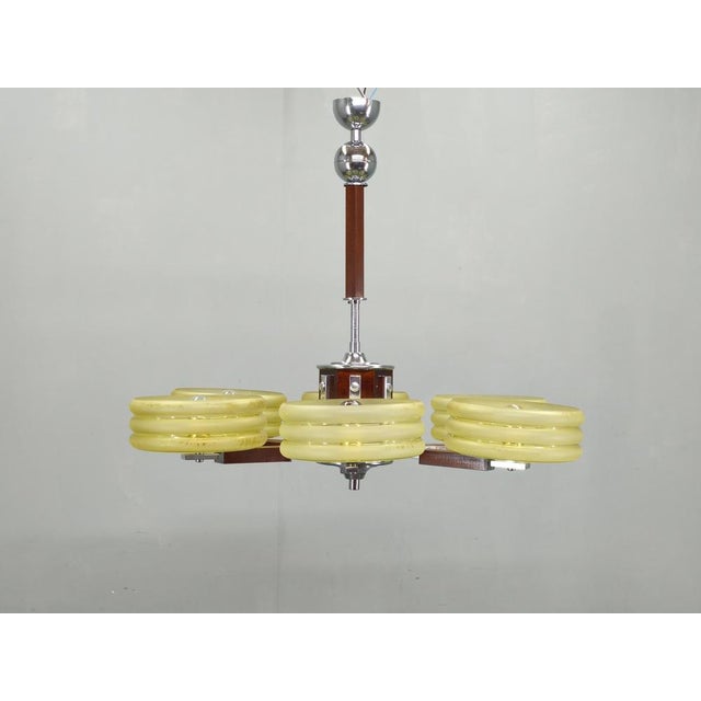 Exceptional art deco chandelier produced in czechoslovakia during the 1930s, combining refined functionalist aesthetics...