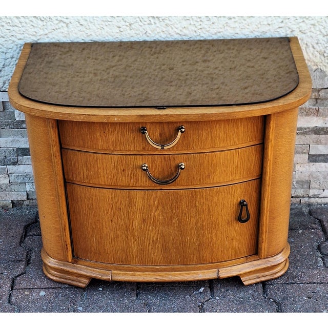 Mid-Century Chest of Drawers in Oak with Drawers, a Door and Tinted Glass Pane, 1950s, in Very Good conditions. Designed...