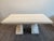 This striking vintage dining table is crafted from beautifully veined ivory-toned stone. Its substantial rectangular top...