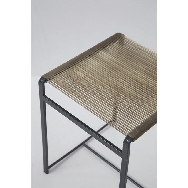 Set consisting of 4 vintage iron stools from the 1960s of fine Italian manufacture. The supporting frame is made of iron,...