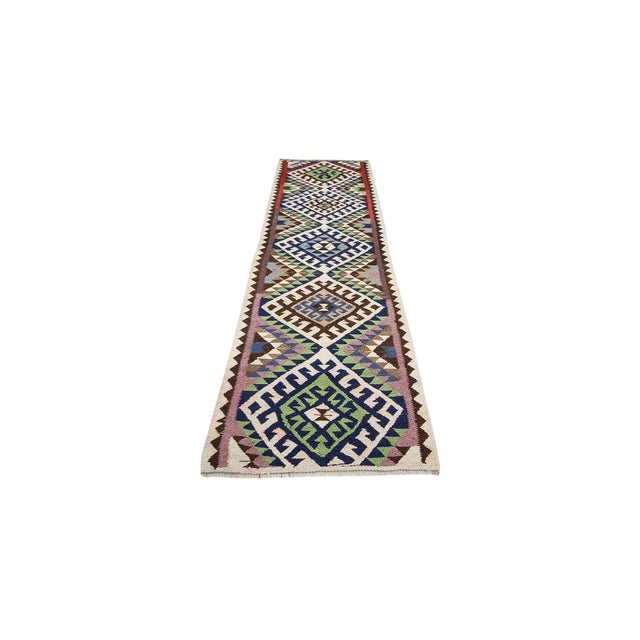 Vintage handwoven decorative kilim runner from Northern Iraq. Approximately 40-50 years old. In very good condition.