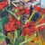 An original oil painting depicting a bouquet of deep crimson roses arranged in a glass vase against a richly layered...