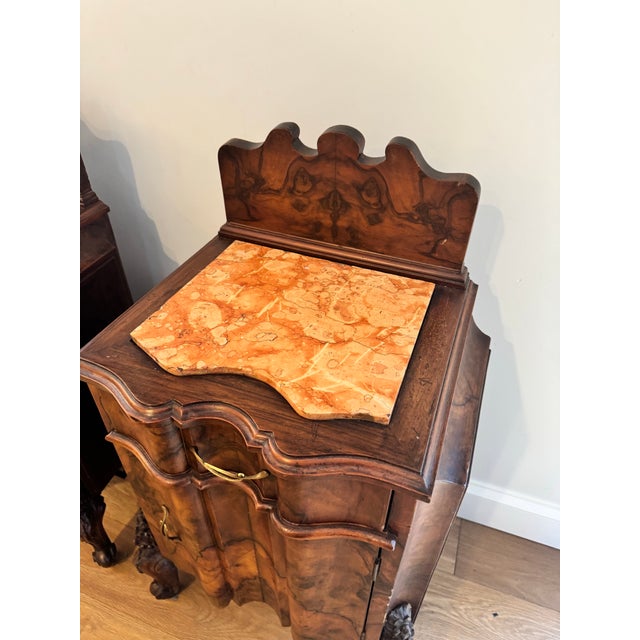 Rare matched pair of Victorian Rococo Revival bedside cabinets, circa 1870–1885, crafted in richly figured walnut with...