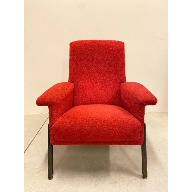 Armchair from the '60s, black lacquered iron structure with brass terminals and red teddy fabric.