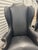 Pair of vintage leather chairs. Tall backs with Irish form. Leather upholstery, nailhead details. Wood frames.
