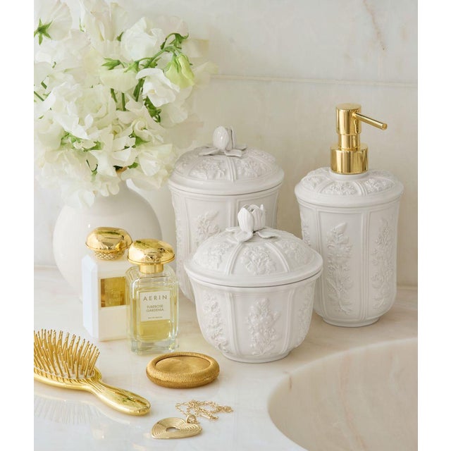 Inspired by 19th century Italian decor, this ceramic lidded canister is beautifully decorated with a relief floral...