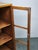 A rare oak and glass bookcase or display cabinet dating from the 1930s, originating from a former Baťa factory in...