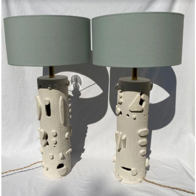 Set of 2 standing lamp by olivia cognet. Materials: ceramic, fabric, metal. Dimensions: h 50 cm a new take on the curves...