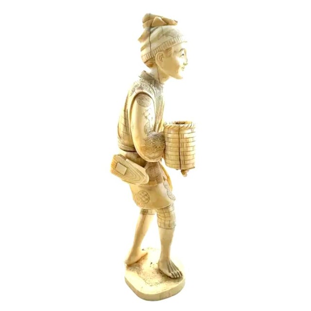 Hand-carved free-standing Japanese Fisherman Figurine. Okimono is a Japanese term meaning for display as an art or...