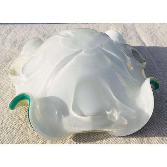 This is a vintage mid century green and white decorative bowl with a swirl design and gold speckles throughout. The bowl...