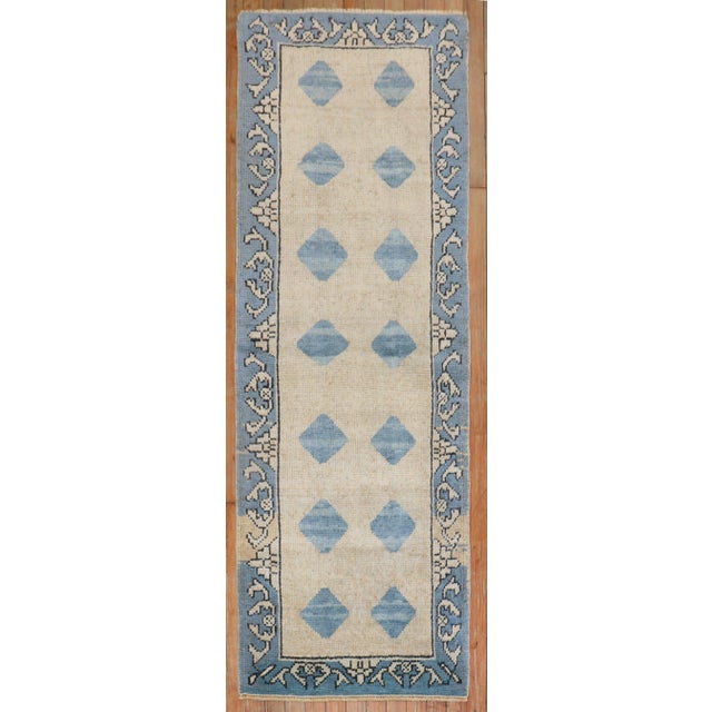 Mid 20th Century beige/tan and blue Turkish Runner size 2' 2" x 6' (66 x 183 cm).