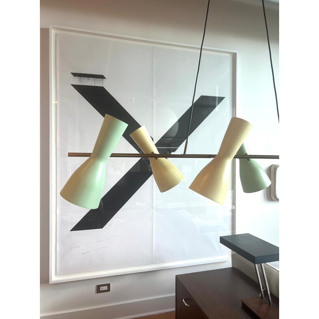 Linear chandelier by Stilnovo. Manufactured in Italy, circa the 1950s. Six double fluted shades run in a sequential...