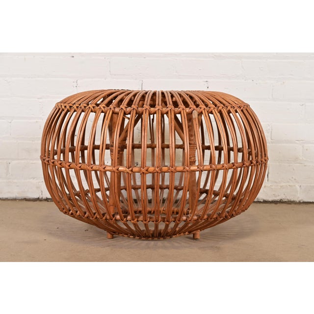 A gorgeous mid-century Organic Modern bent rattan pouf ottoman, footstool, or side table Designed by Franco Albini Italy,...