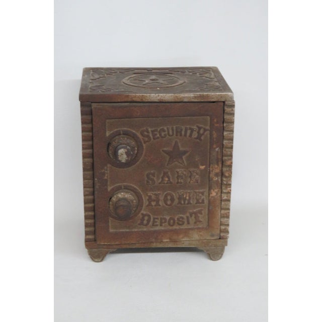 The Security Safe Combination Lock Coin Bank is a must-have collectible item and appears to be made of cast iron. The door...