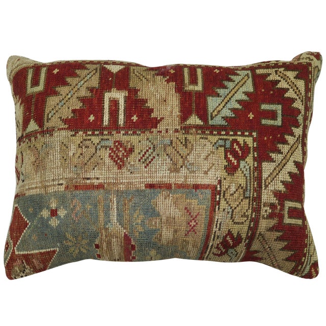 Lumbar size pillow made from a 19th century tribal Caucasian rug in soft blue and red. Measures: 16" x 24".