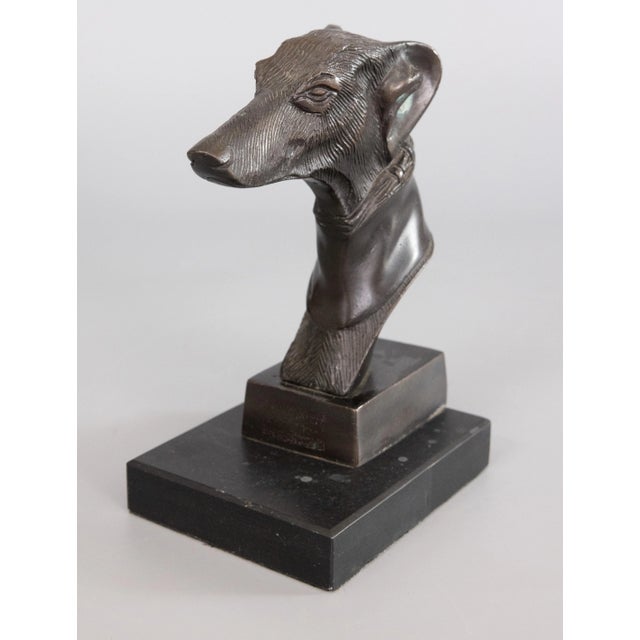A superb vintage bronze greyhound whippet dog bust sculpture on a bronze base. This fine dog is well cast with exquisite...