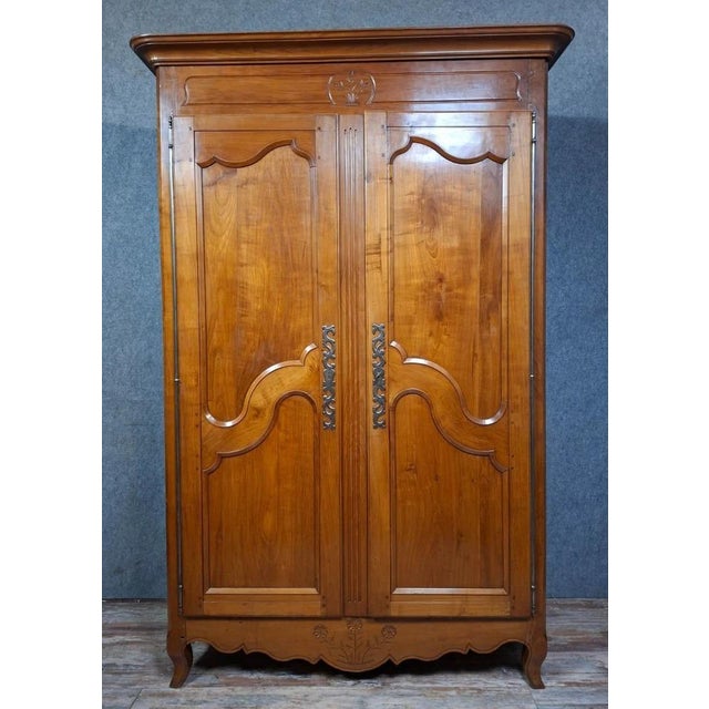 Beautiful solid cherrywood wardrobe, late 18th - early 19th century Featuring two molded doors with scalloped decoration....
