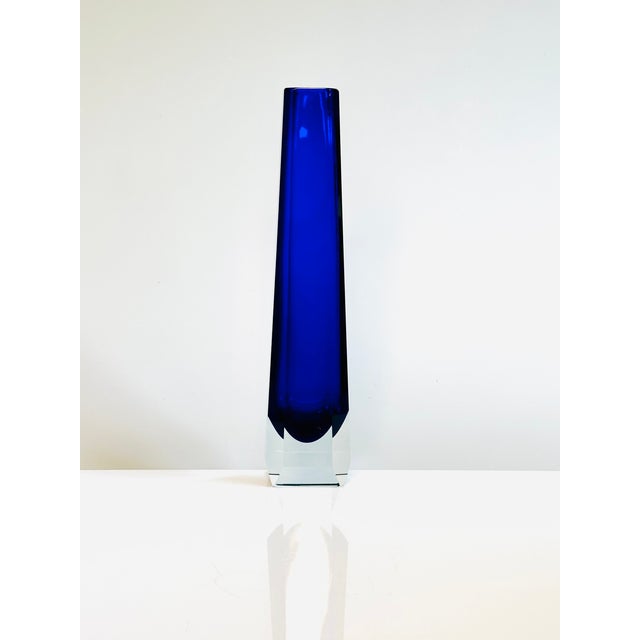 Mid-century vase made of cobalt blue overlay glass, set in a clear geometrically faceted crystal form and manufactured in...