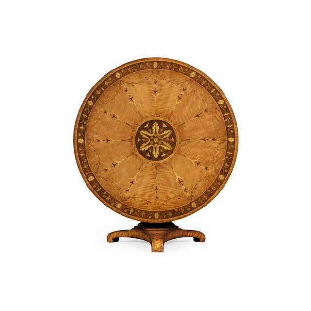 The Satinwood Center Table shows the refined elegance and decorative style of early 19th-century English design. Its round...