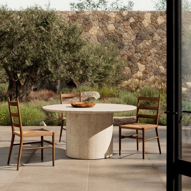 Simple and impactful, this marble outdoor dining table features a pedestal base with a monolithic effect. The base comes...