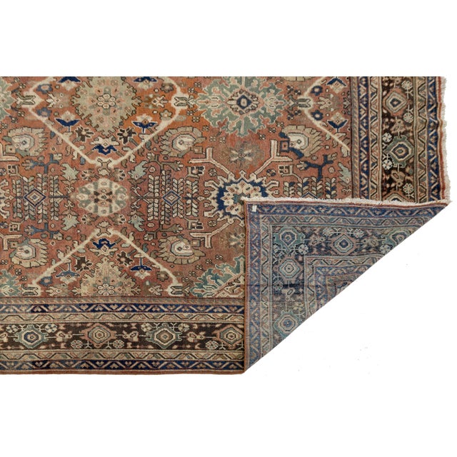Elevate your living space with the soulful artistry of this Vintage Mahal Persian Rug. Hand-knotted by skilled artisans in...