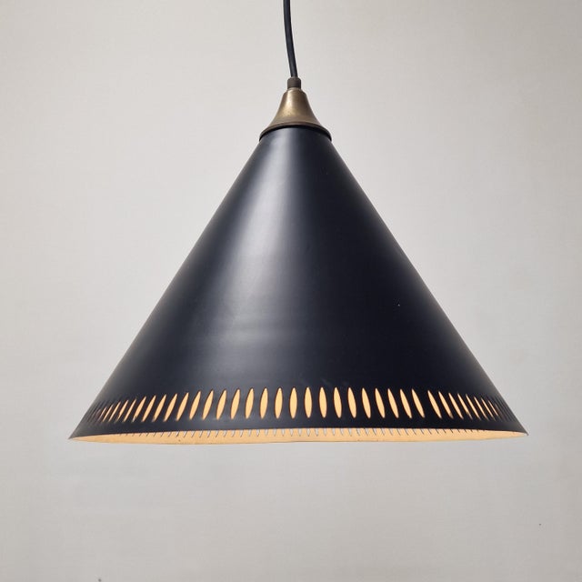 Iconic Scandinavian modern pendant lamp, model “Kegle”, designed by Bent Karlby for Lyfa, Denmark, circa 1970s. This...