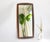 A vintage Danish wooden wall mirror made out of teak with a beautiful frame with a black detail inside. The mirror is...