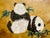 This is a beautiful painting on cork featuring: • Subject: The painting depicts two pandas sitting amidst a bamboo grove....