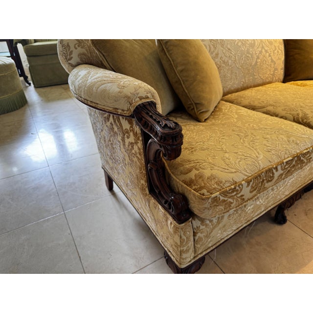 Enjoy regal elegance with this exquisite Chippendale-style camelback sofa. Perfectly suited for a formal living room,...