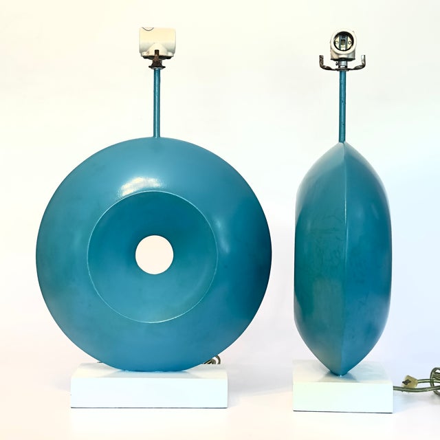 This striking table lamp features a bold, sculptural design that seamlessly bridges mid-century artistic expression with...