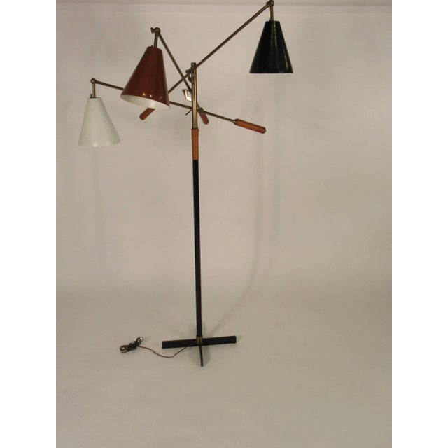 Beautiful rare version of the Triennale floor lamp by Arredoluce in brass with brown pigskin handles. Original white,...