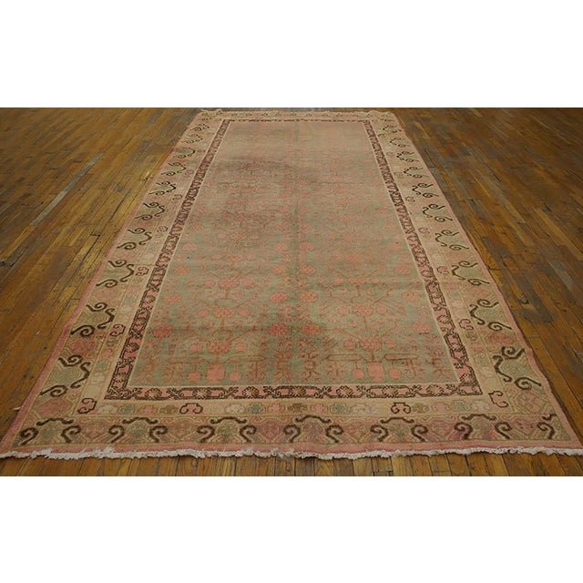 Antique Chinese Khotan rug, size: 6'2" x 12'2". Antique Khotan Allover Floral Hand Knotted Pile East Turkestan Rug, Circa...