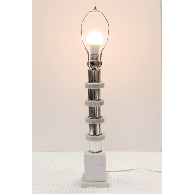 1970s table lamp with cool white and gray marble rings on a chrome center pole. 3-way knob on socket. Dimension:28-inch H...