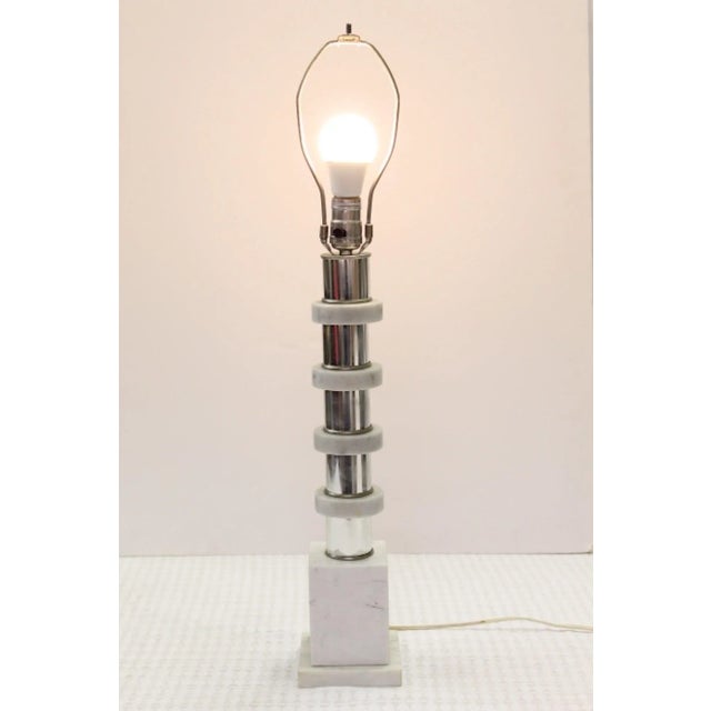 1970s table lamp with Carrara white and gray marble rings on a chrome center pole anchored in a solid block of marble....