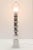 1970s table lamp with Carrara white and gray marble rings on a chrome center pole anchored in a solid block of marble....
