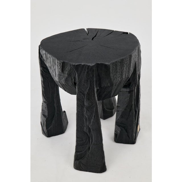 Chainsaw carved coffee table. Carved from a single piece of burnt oak wood and protected with the highest quality oils,...