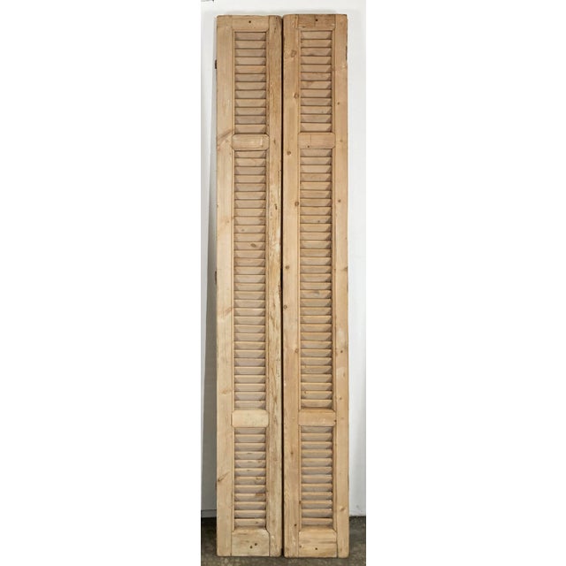 Pair of bleached antique French shutters featuring wonderful time-worn character and patina. Ideal for use as decorative...