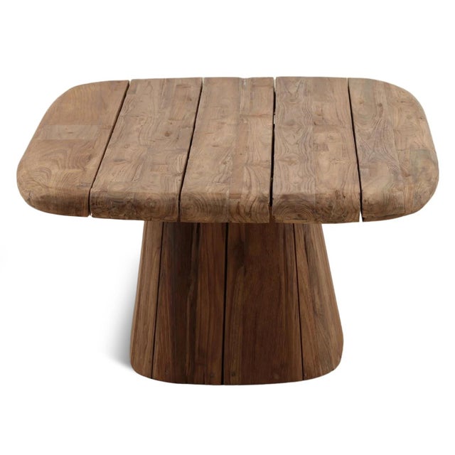 Crafted from solid salvaged teak, this sculptural coffee table showcases thick plank construction, softly rounded edges...
