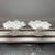 A pair of vintage Fenton Silver Crest milk glass compotes or candy dishes featuring a distinctive ruffled edge with a...
