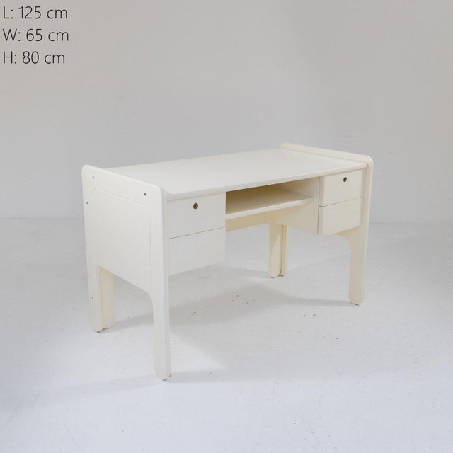 White lacquered wooden desk, Italian production from the 1970s. Double drawers on both sides, convenient shelf under the...