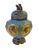 This is a round fat body incense ding burner made of metal and covered with blue & yellow enamel color. There are floral...